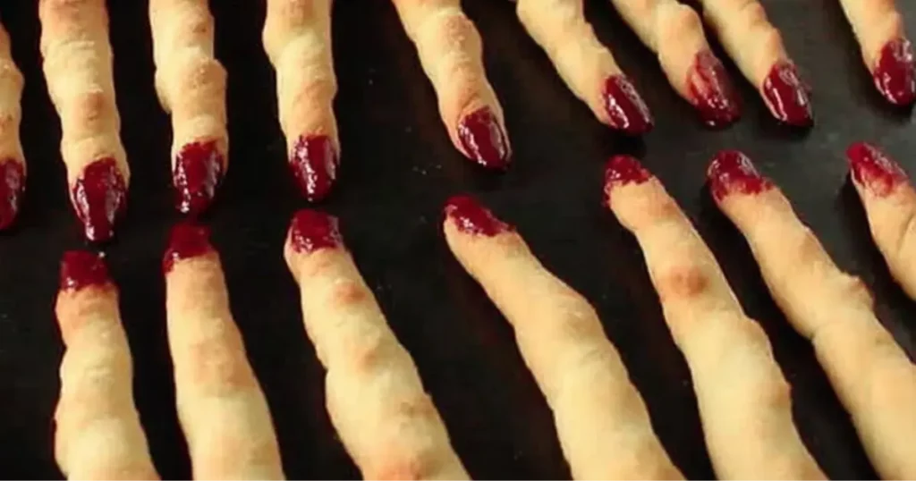 witch finger breadsticks with almond nails baked for Halloween pasta
