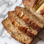 Banana Ribbon Loaf with Cultured Milk showing a structured crumb and subtle internal ribbon